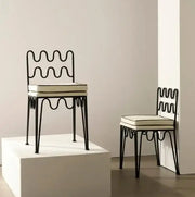 Black wrought iron retro wave dining chair with cream upholstered seat from decorbites french retro dining table set