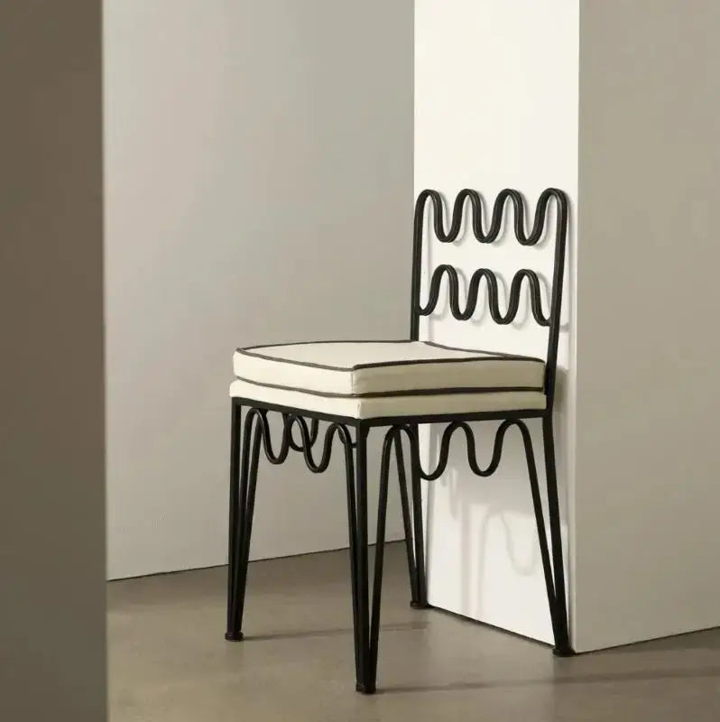 Black wrought iron retro wave dining chair with cream cushioned seat and backrest from decorbites french retro set