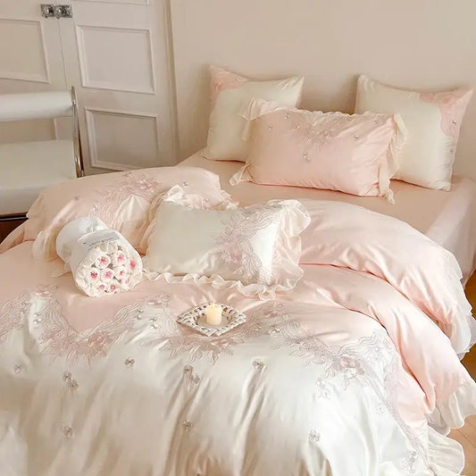 Pastel pink satin bedding set with delicate floral embroidery and lace ruffles by decorbites french romantic collection
