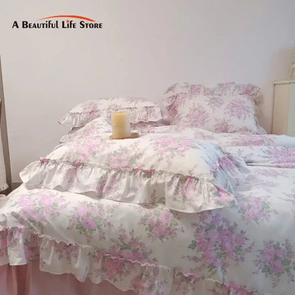 Pink floral ruffled cotton bedding set with french rose flowers print and soft layered design for bedroom use