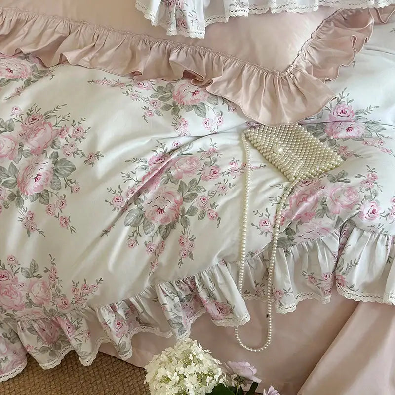 A delicate cream-colored clutch with pearl detailing and ruffled edge complements decorbites french rose lace bedding set