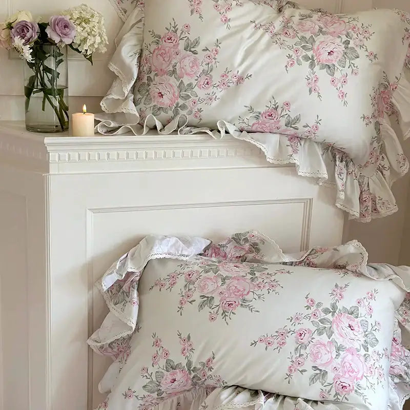 Floral-patterned pillowcases with soft pink roses and ruffled edges in decorbites french rose lace pink and white bedding set