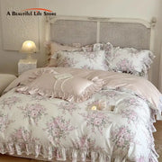 Pastel pink and white floral bedding set with delicate ruffles featuring decorbites french rose lace design