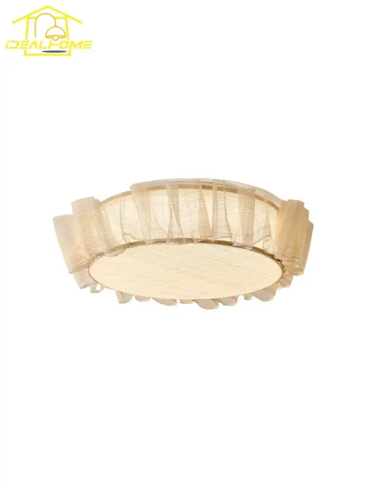 Beige circular ceiling light with ruffled fabric shade and wooden base from decorbites cream wind led collection for bedroom