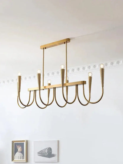 A modern gold-toned metal pendant light with sleek curved arms and exposed bulbs for decorbites french style black decor