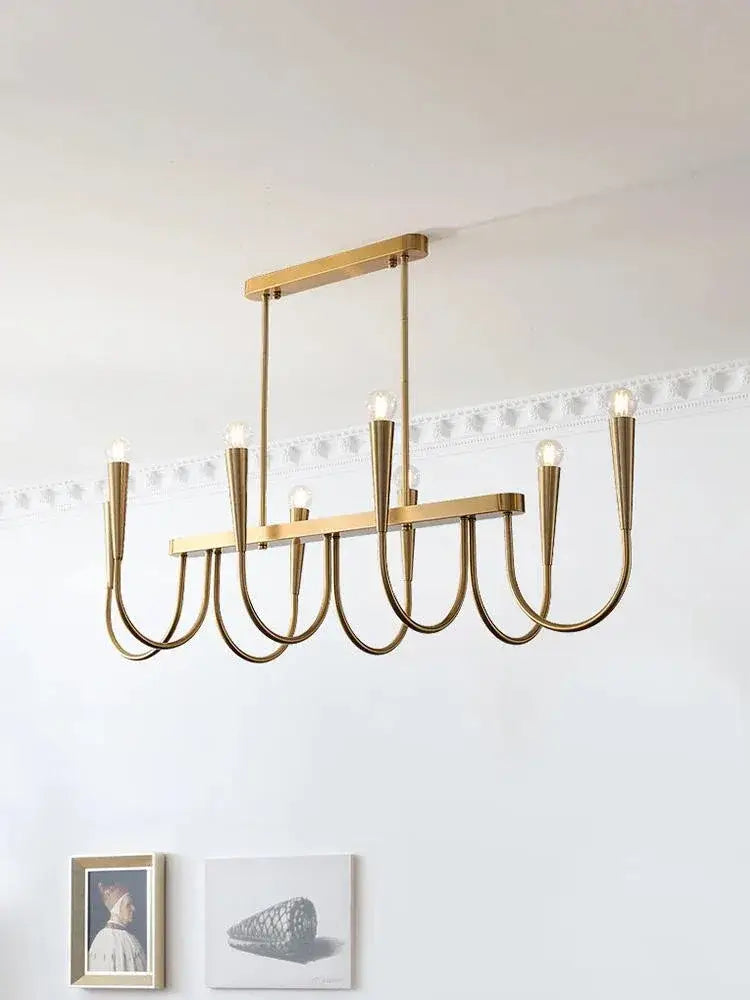 A modern gold-toned metal pendant light with sleek curved arms and exposed bulbs for decorbites french style black decor
