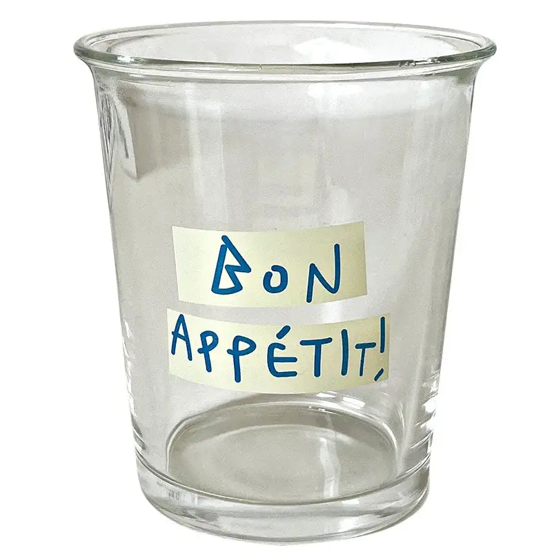 Clear glass tumbler cup with bon appétit on beige sticky notes designed for french style kitchen use