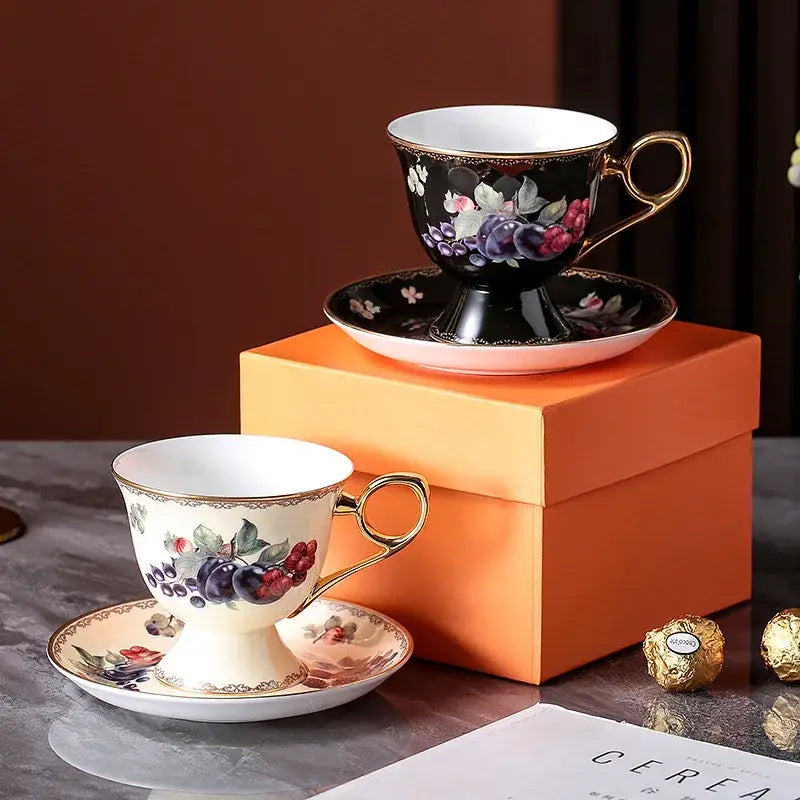 Elegant black and cream porcelain teaware set tea cup with gold rims and intricate fruit floral hand-painted decorbites bone design