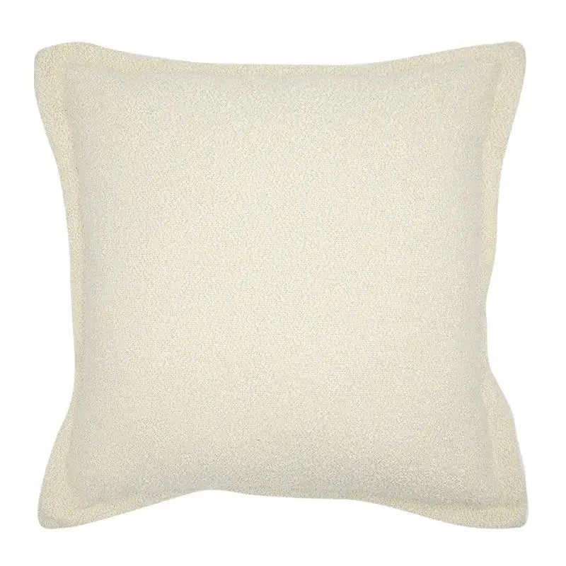 Cream-colored square throw pillow with soft textured fabric finish for french style decorbites french style living room decor