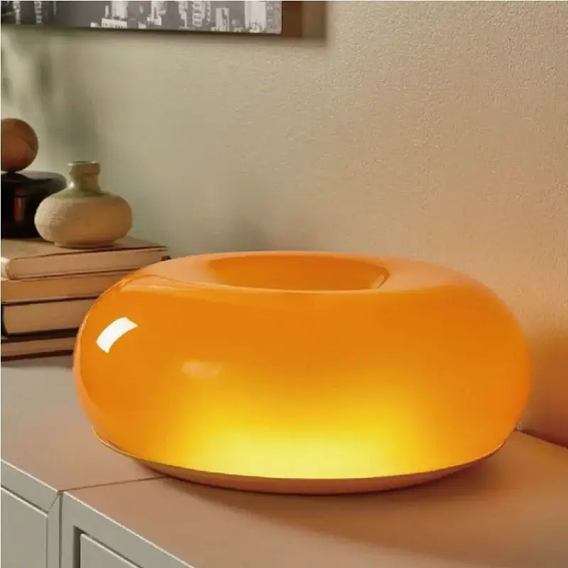 French style orange glossy ceramic decorative wall lamp with warm glowing interior light for bedroom use