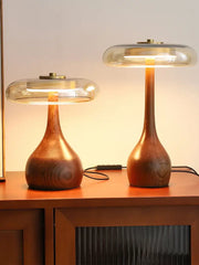 Two elegant french style walnut table lamps with smooth warm finishes and glass dome for bedroom lighting