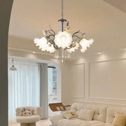 French style white decorbites crystal flower chandelier with delicate floral design and black wrought iron arms for living room lighting