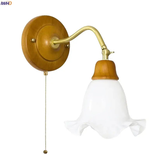 French vintage copper wall sconce with brass articulated arm, wood base, white glass bell shade, and pull chain switch