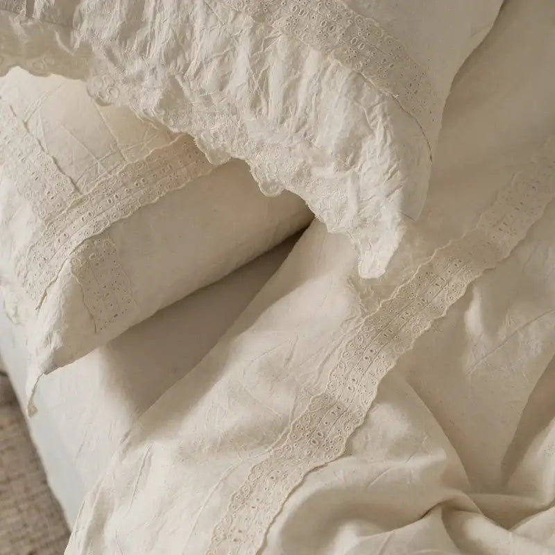 Cream-colored linen pillowcases with delicate eyelet lace trim from french vintage cream cotton linen bedding set decorbites cotton linen