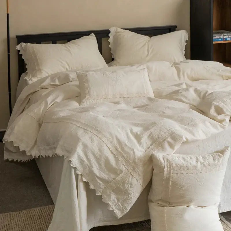 Cream-colored french vintage cotton linen bedding set with delicate ruffled edges and subtle embroidery by decorbites cotton linen