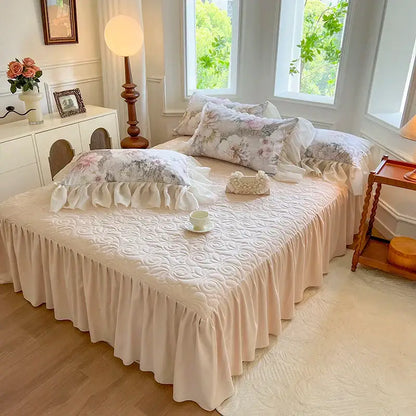 Beige quilted bed skirt with ruffled hem and matching floral pillowcases in decorbites french vintage lace bedding set
