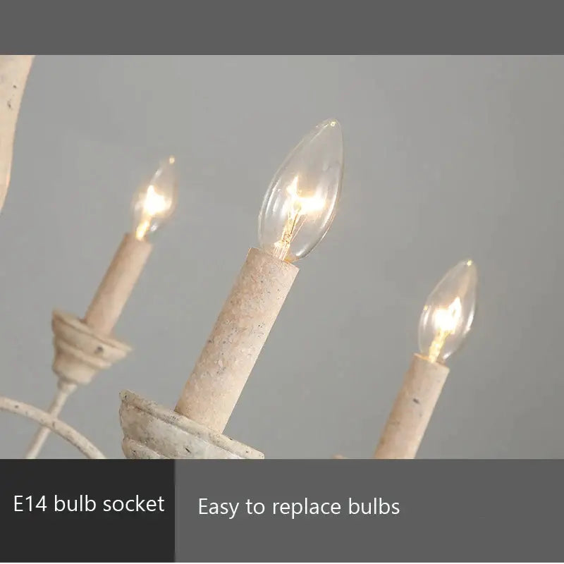 White distressed french vintage wooden chandelier with three lit candle-style bulbs for dining room decorbites vintage wooden chandelier