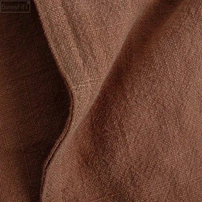 Fringed earth tone pillow cover made of soft brown decorbites linen fabric with textured weave for living room decor