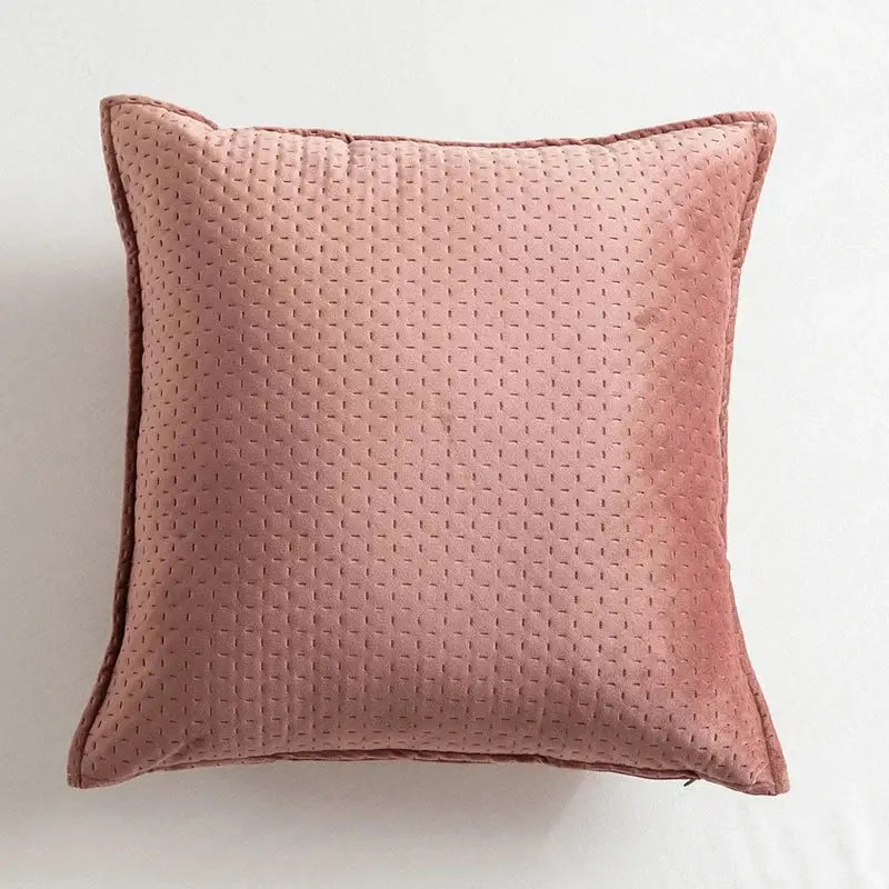 Soft blush pink quilted throw pillow with subtle dotted texture and neatly stitched edges in decorbites fringed velvet cushion cover