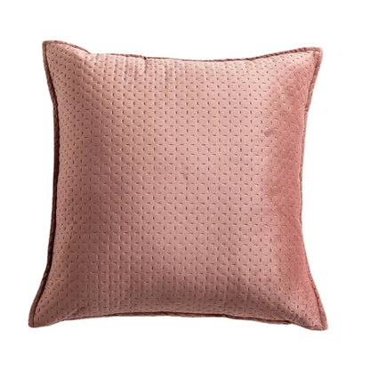 A soft rose-colored fringed velvet cushion cover with subtle quilted texture and neatly stitched edges for living room decorbites
