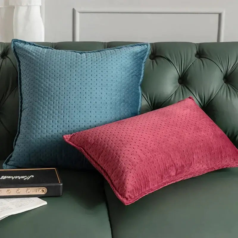 Two fringed velvet cushion covers in teal blue and vibrant magenta with textured quilted pattern for living room decorbites decor
