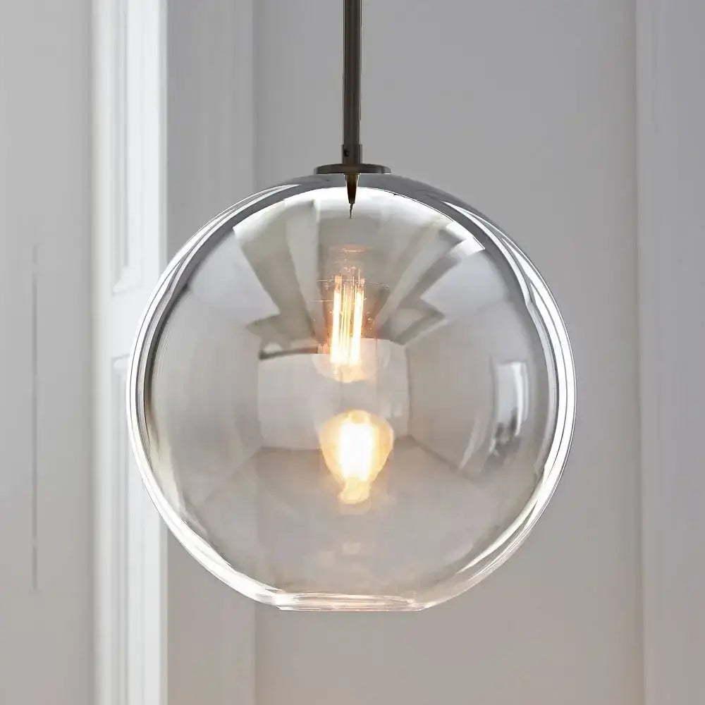 Clear glass ball pendant light with dark metal chain for dining room decorbites glass ball pendant light