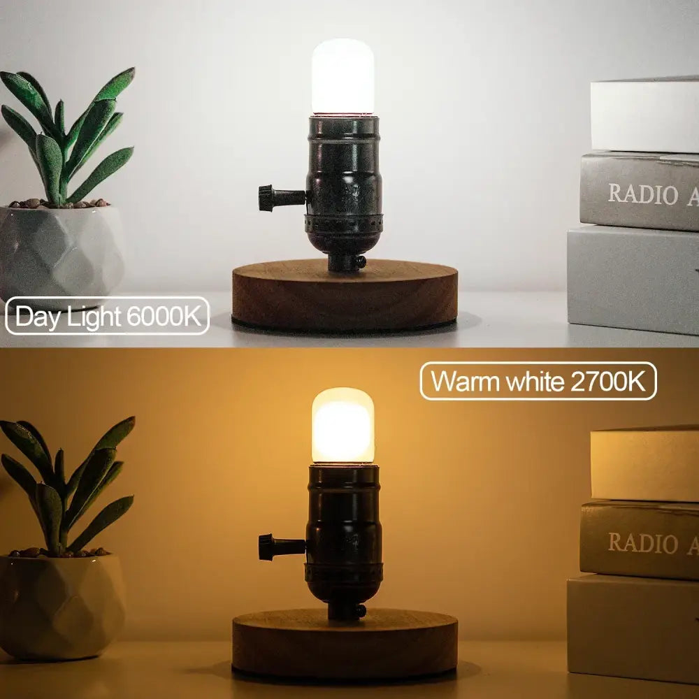 Industrial-style table lamp with black metal base and warm white tubular led light bulb for kitchen use