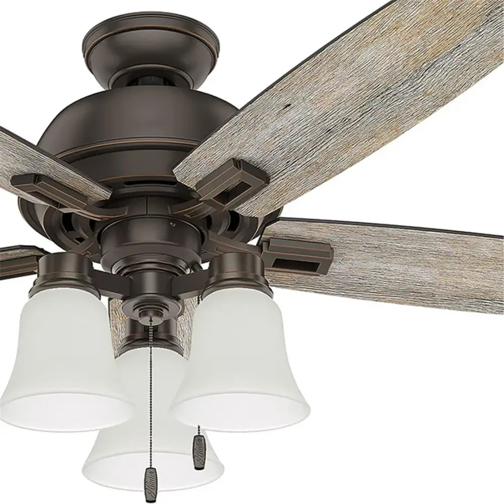 This hunter ceiling fan features five rustic wood blades and three frosted glass bell shades by decorbites
