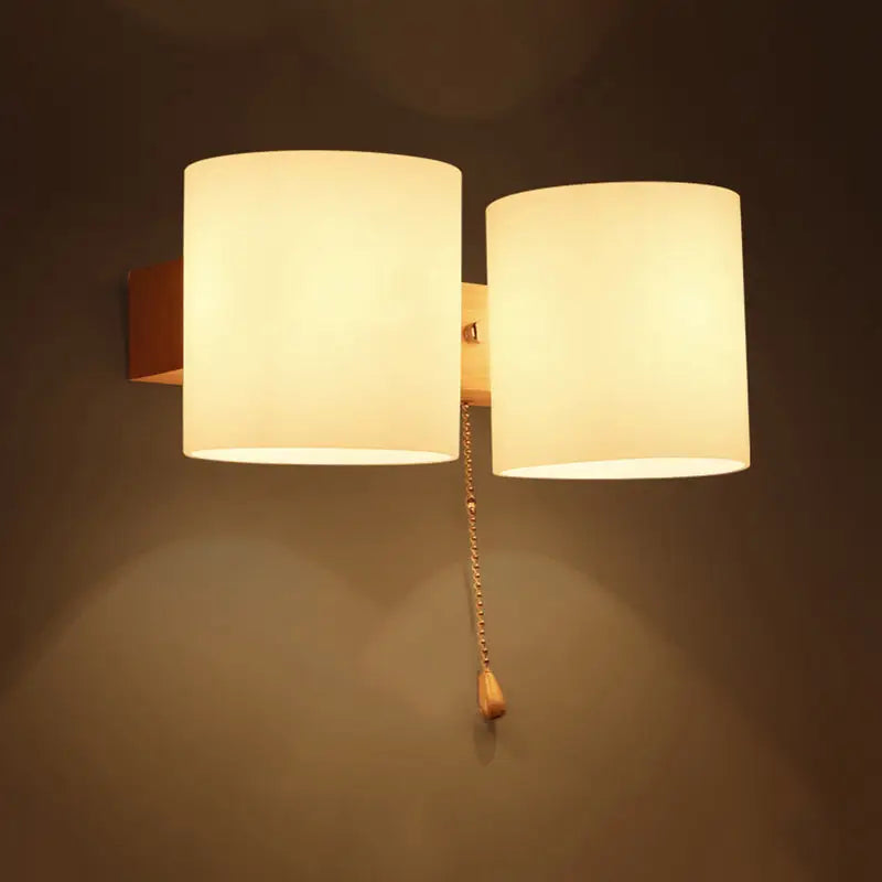 Warm-toned frosted glass copper wall lamp with brass chain pull switch for bedroom wall lighting direct wired electric use