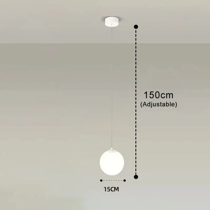 Frosted glass pendant light with a minimalist white spherical globe brass and black finish for dining room use