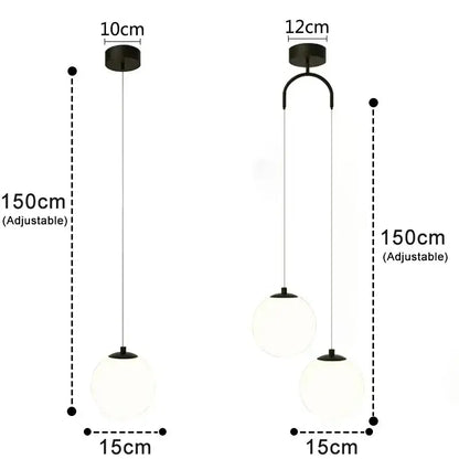 Modern black pendant light with frosted glass globe shades and adjustable hanging length for dining room use