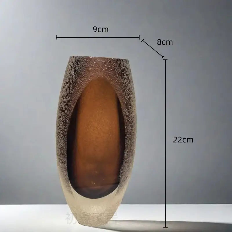 A tall slender frosted glass vase with textured speckled brown and amber glass by decorbites for living room decor