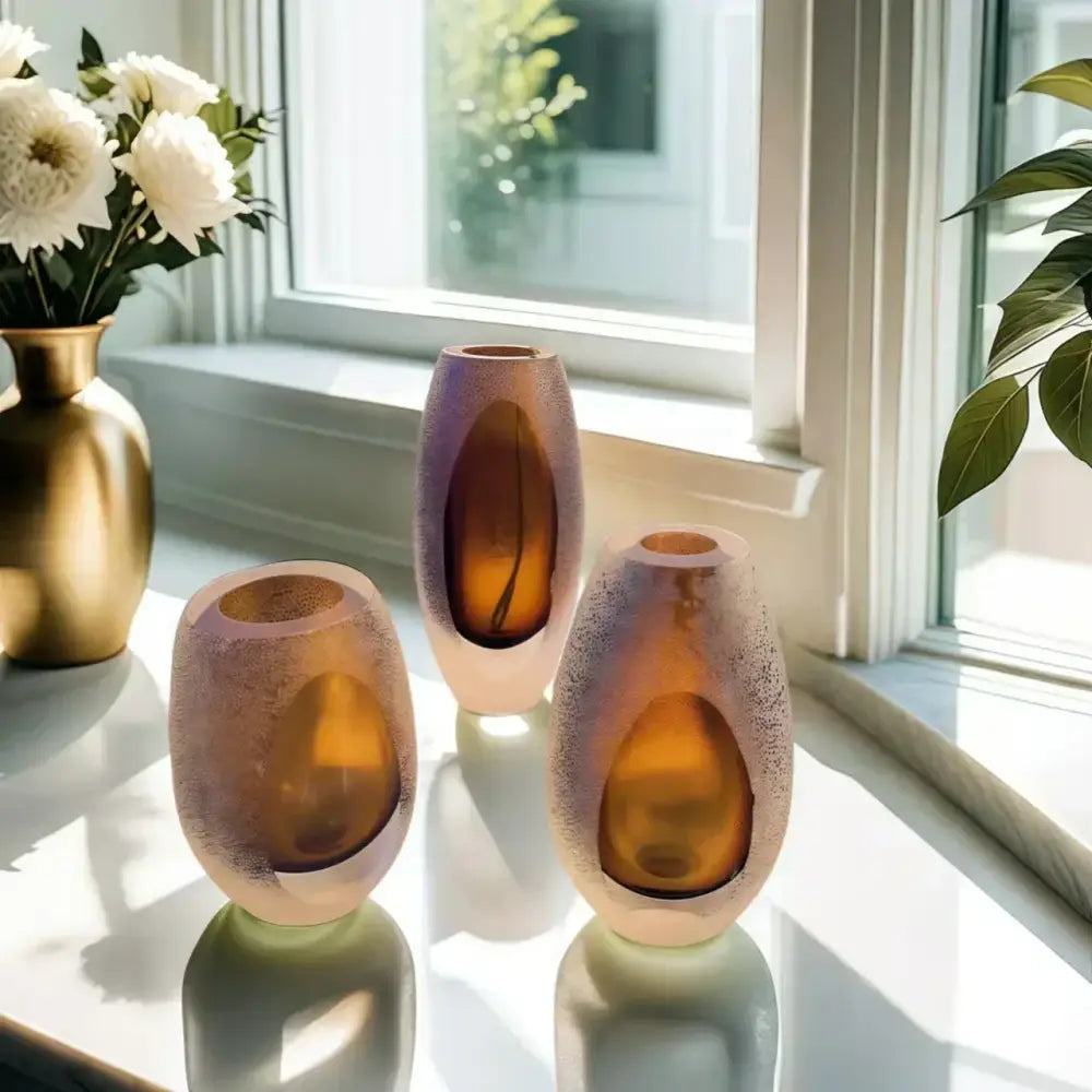 Three amber frosted glass vases with textured speckled finish and oval cutouts decorbites frosted glass vase trio