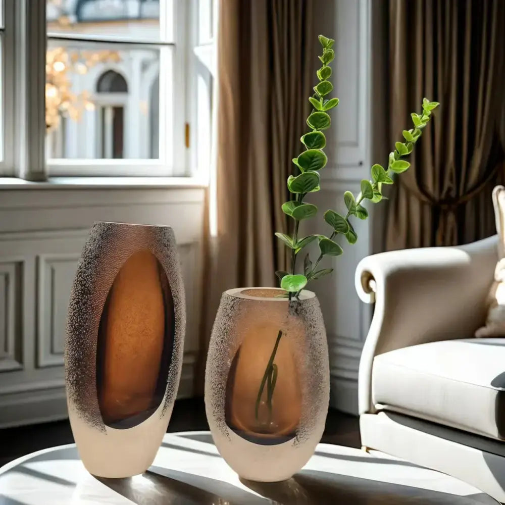 Two amber textured frosted glass vases with oval cutouts from decorbites frosted glass living room decor trio