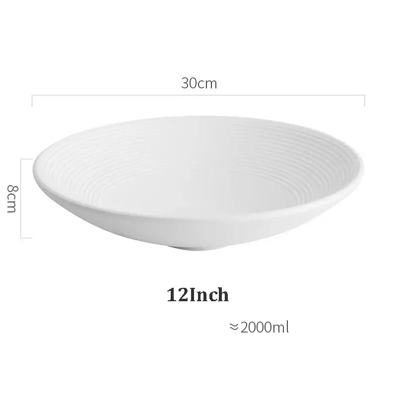 A frosted glaze white ceramic soup bowl with subtle concentric ridges by decorbites measuring 30cm by 8cm