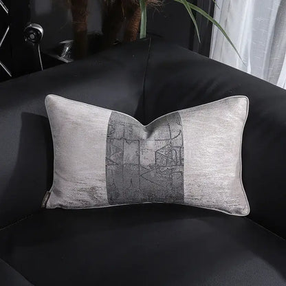 A rectangular gray pillow cover with a metallic sheen and abstract geometric panel from decorbites frosted gold satin collection