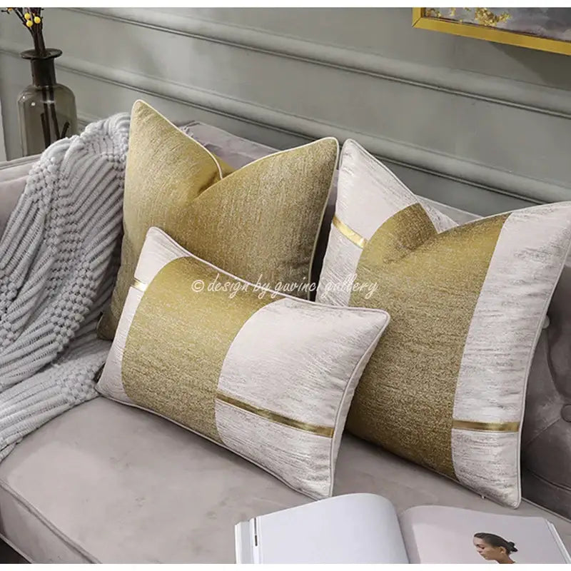 Frosted gold satin pillow covers with gold and white geometric velvet pattern and metallic gold trim by decorbites