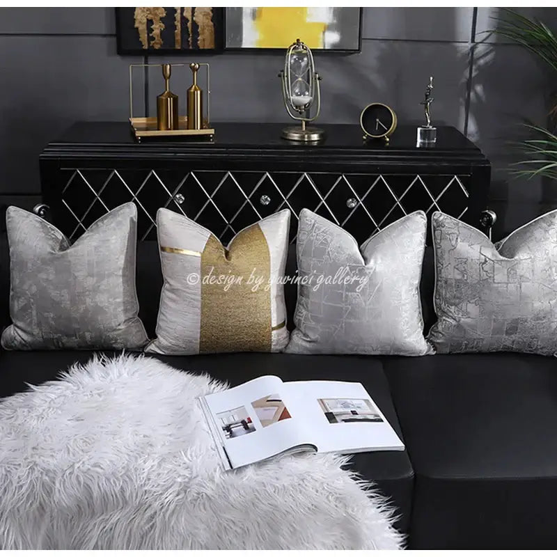 Four elegant silver and gold velvet pillow covers with intricate patterns and a bold gold stripe by decorbites frosted gold satin