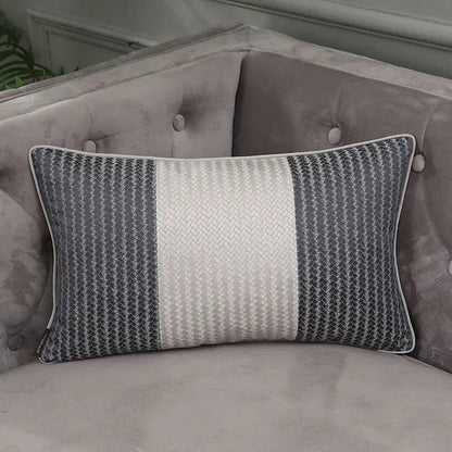Gray and white striped pillow cover with woven texture on tufted gray sofa from decorbites frosted gold satin collection