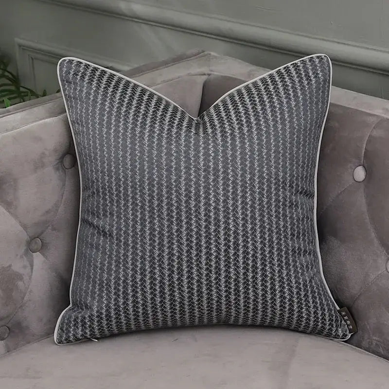 Gray cushion with subtle herringbone pattern and white piping on tufted sofa for decorbites frosted gold pillow covers