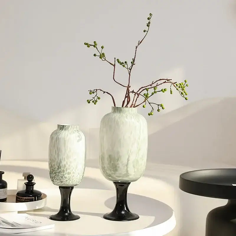 Elegant green frosted marbled glass vase with dot texture on sleek black pedestal base for decorbites dot texture decor