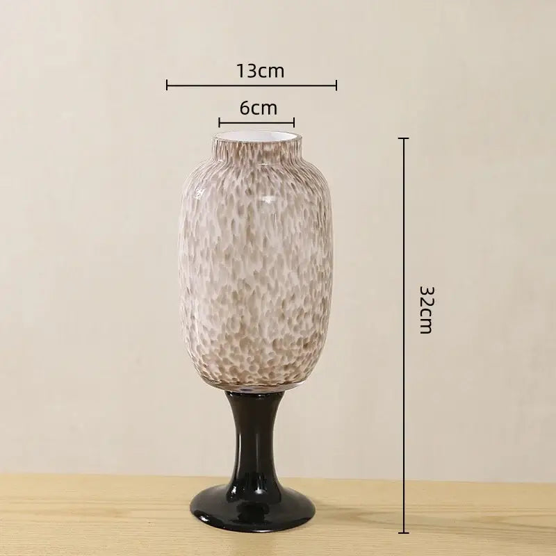 Frosted marbled dot texture glass vase in translucent beige with black glossy pedestal base for living room decorbites dot texture