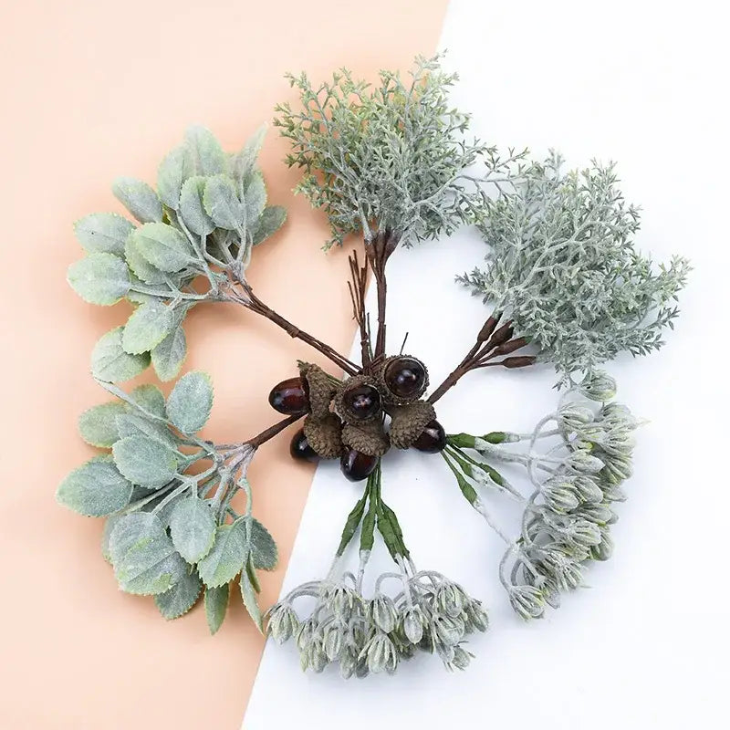 Frosted silver and brown decorative artificial plants bundle featuring artificial greenery with frosted leaves and dark acorns