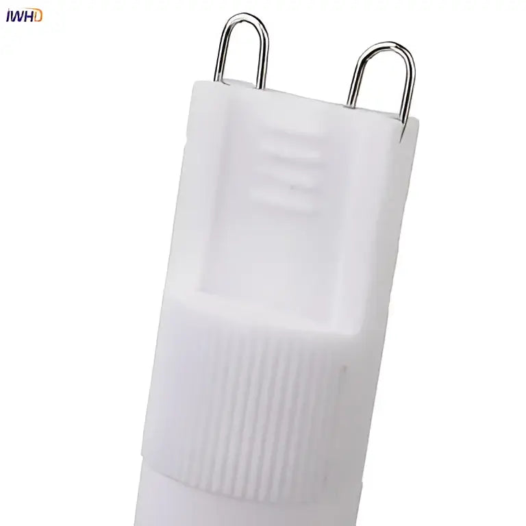 Frosted white ceramic g9 led bulb with ribbed texture and metallic contacts for energy-efficient lighting decorbites creamic