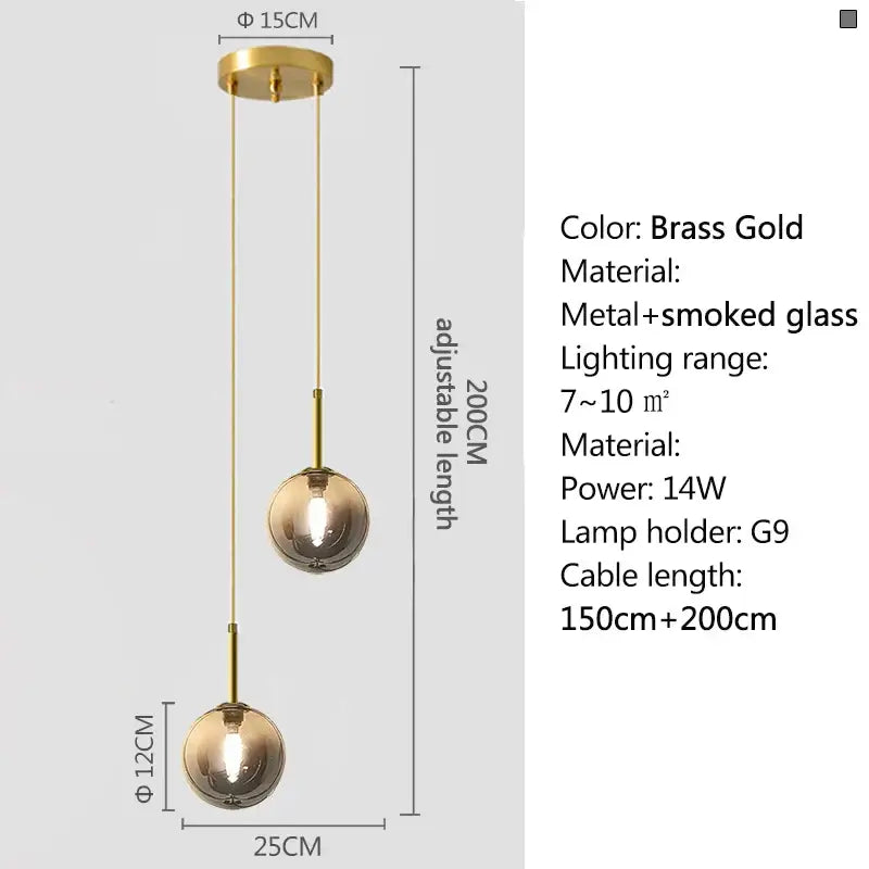 Brass gold pendant light with two smoke gray spherical globes suspended by adjustable metal chains for dining room