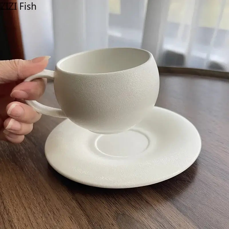 Minimalist white ceramic cup and saucer set with textured matte finish from decorbites frosted collection for dining room