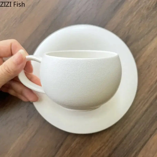 Frosted white textured ceramic cup and saucer set by decorbites with a matte finish for elegant dining room use