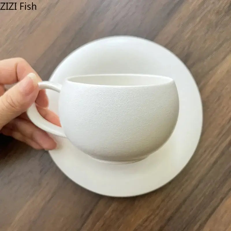 Frosted white textured ceramic cup and saucer set by decorbites with a matte finish for elegant dining room use