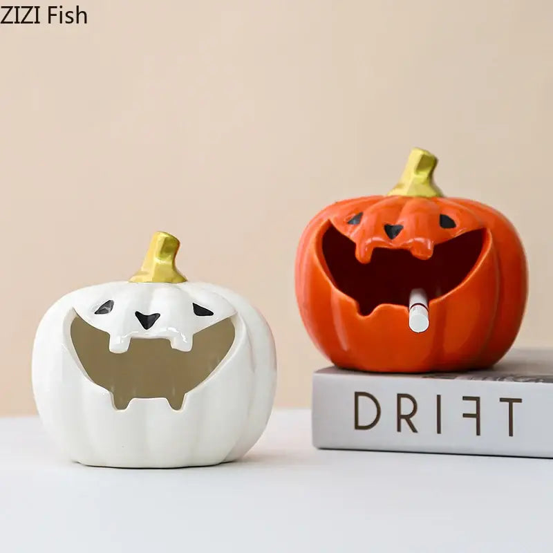 Funny orange ceramic halloween pumpkin ghost ashtray with gold stem and carved mouth holding a cigarette for office decor