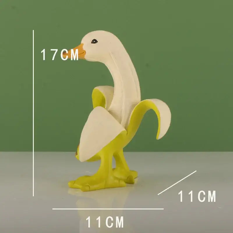 Whimsical white and yellow duck sculpture with orange beak designed as a banana duck sculpture for living room decor